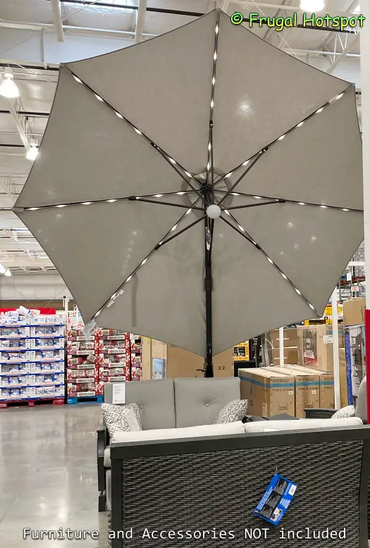 Seasons Sentry 11' Round Solar LED Cantilever Umbrella with lights on | Costco