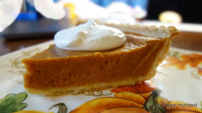 Profile view of slice of Costco Pumpkin Pie with Whipped Cream | Frugal Hotspot