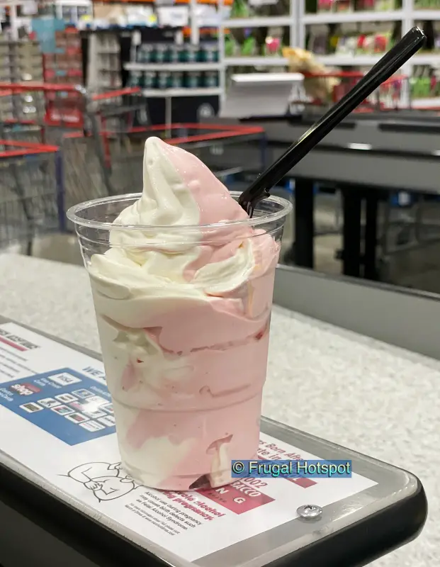 Strawberry Vanilla Twist Soft Serve Ice Cream with a spoon | Costco Food Court